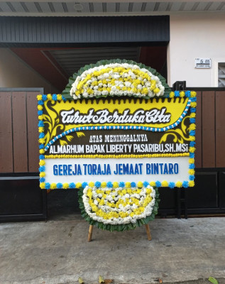 Papan Bunga Duka di Poom
